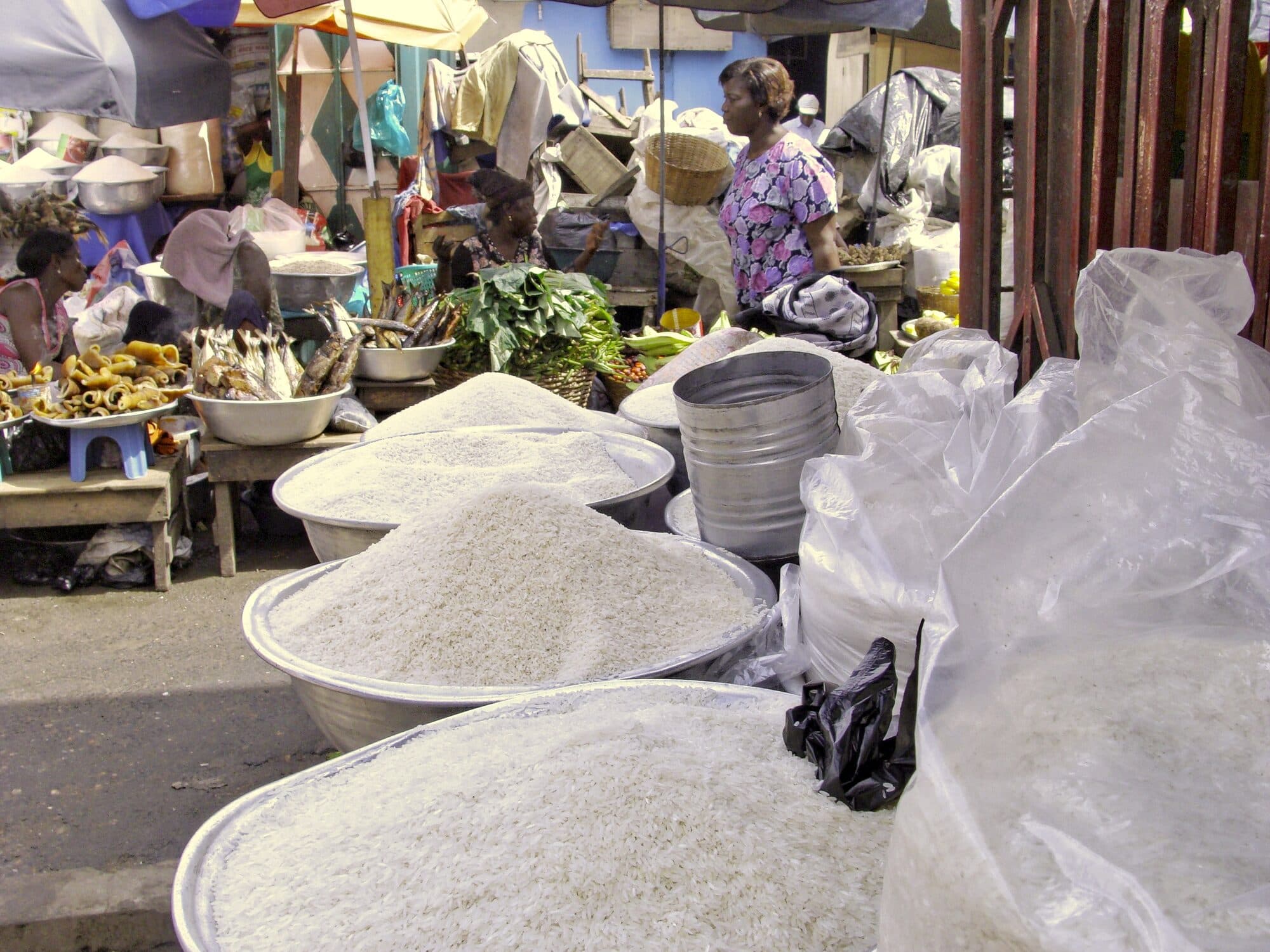 Bowls of grain and pulses set out at a market stall