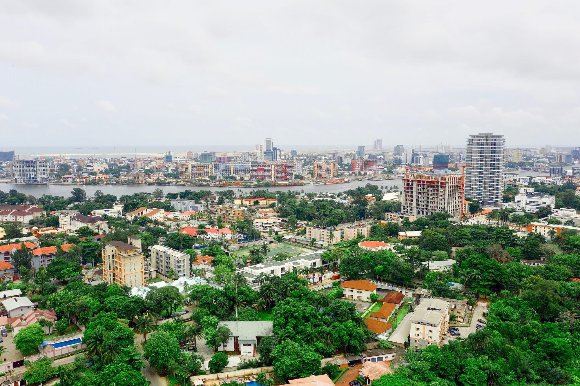 Ikoyi from the air, rooftops and towers running to the lagoon
